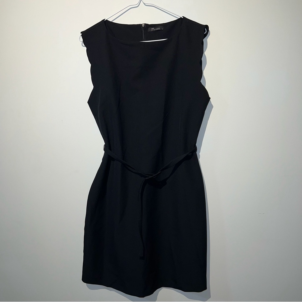 Sleeveless black dress with a belt
